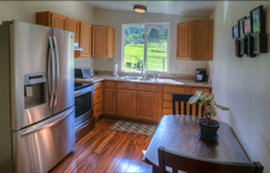 The kitchen is modern and fully equipped